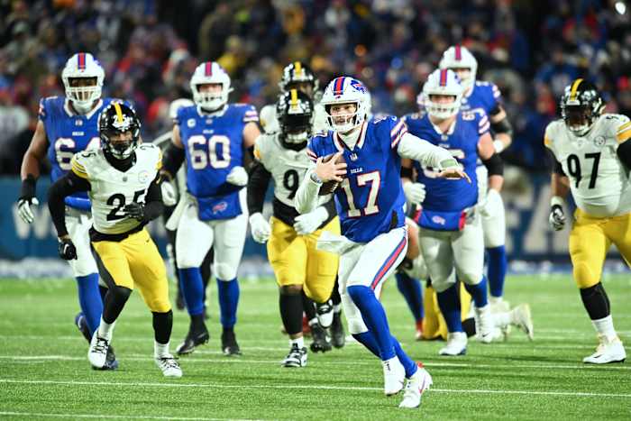Buffalo Bills quarterback Josh Allen runs through the Pittsburgh Steelers' defense for a 52-yard touchdown in an AFC wild-card game Saturday.